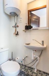 a bathroom with a toilet and a sink at Jelgavas 52 Old town 5 min 4 can stay Free parking Self check in out in Rīga