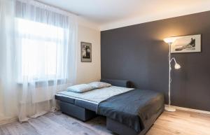 a bedroom with a bed and a window at Jelgavas 52 Old town 5 min 4 can stay Free parking Self check in out in Rīga