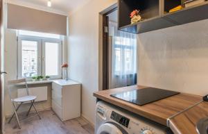 a kitchen with a sink and a washing machine at Jelgavas 52 Old town 5 min 4 can stay Free parking Self check in out in Rīga