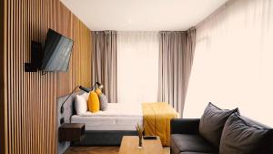 TV a/nebo společenská místnost v ubytování Jono kalnelis Apartments