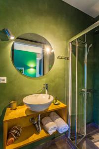 a bathroom with a sink and a mirror at Koukounari Living Spaces in Preveza +67 photos
