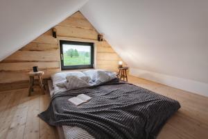 Postel nebo postele na pokoji v ubytování Osada Augustów + 37 fotografií