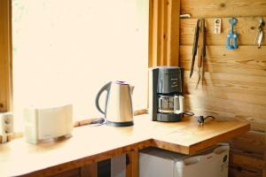 a coffeemaker sitting on a counter in a kitchen at Niidupuu Camping in Mändjala