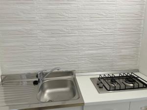 a kitchen with a sink and a stove at Casa di Clara in Rapallo +11 photos