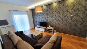 En TV eller et underholdningssystem på Apartments Spring