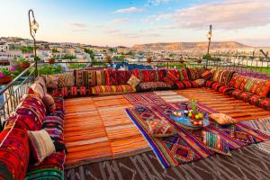 a large couch sitting on top of a balcony at Lord of Cappadocia Hotel in Göreme