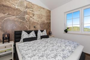 Ein Bett oder Betten in einem Zimmer der Unterkunft Villa Santa Maria