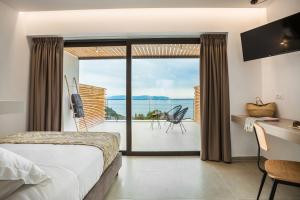 Posteľ alebo postele v izbe v ubytovaní Kefalonian Escape Suites