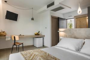 Posteľ alebo postele v izbe v ubytovaní Kefalonian Escape Suites