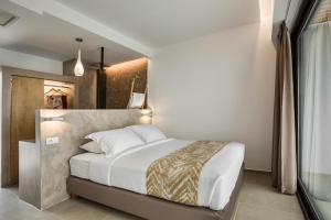Posteľ alebo postele v izbe v ubytovaní Kefalonian Escape Suites