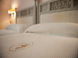 Postel nebo postele na pokoji v ubytování Hotel Bahia