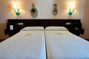 Postel nebo postele na pokoji v ubytování Hotel Bahia