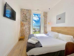 Posteľ alebo postele v izbe v ubytovaní Mirandoalaconcha Rooms