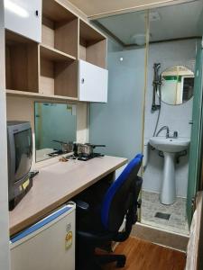 an office with a desk with a chair and a sink at Bestel Residence in Seoul