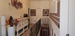 a kitchen with a stove and a refrigerator at B&B Villa Rivabella in Bologna