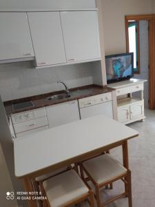 Kuchyň nebo kuchyňský kout v ubytování Duerming Velero Apartamentos