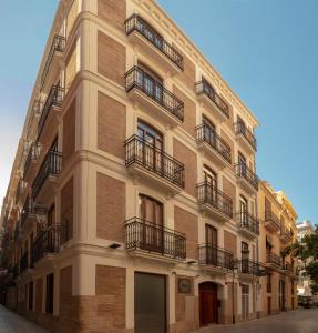 a building with balconies on the side of it at SH Suite Palace in Valencia