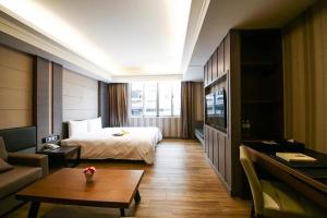 Postel nebo postele na pokoji v ubytování Talmud Hotel Tainan