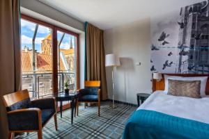 Posteľ alebo postele v izbe v ubytovaní Hotel Hanza