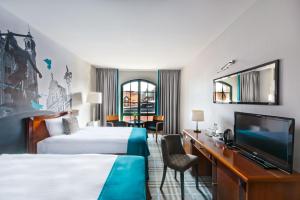 Posteľ alebo postele v izbe v ubytovaní Hotel Hanza