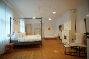 a bedroom with a canopy bed in a room at Skärva Herrgård in Karlskrona