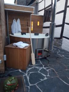 a bathroom with a bath tub and a bat at Maison Zanella in Durbuy +28 photos