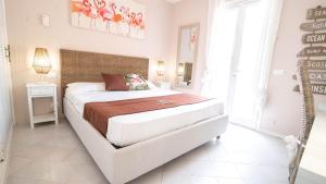 Postel nebo postele na pokoji v ubytování Hotel Il Perseo