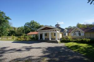 a large house with a driveway in front of it at Skärva Herrgård in Karlskrona