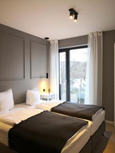 Un pat sau paturi într-o cameră la Ferienhaus Stadtblick