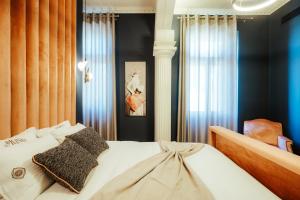 Posteľ alebo postele v izbe v ubytovaní Espero Royal Stay