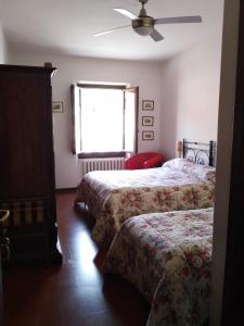 Posteľ alebo postele v izbe v ubytovaní Albergo Giovanni Da Verrazzano