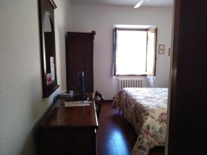 Posteľ alebo postele v izbe v ubytovaní Albergo Giovanni Da Verrazzano
