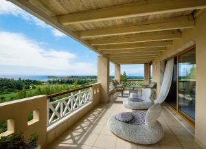 a balcony with a view of the ocean at Sanidiamonds in Sani Beach