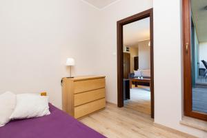 Postel nebo postele na pokoji v ubytování Apartamenty Bliska Praga by Noclegi Renters