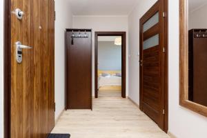 Postel nebo postele na pokoji v ubytování Apartamenty Bliska Praga by Noclegi Renters