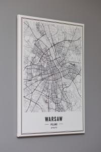 a framed map of the city of warsaw at Apartamenty Bliska Praga by Renters in Warsaw