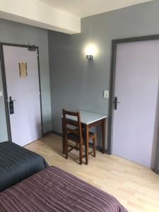 Postel nebo postele na pokoji v ubytování L'embellie
