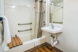a bathroom with a sink and a shower at Motel 6-Irving, TX - Dallas in Irving