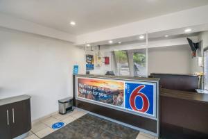 a large flat screen tv sitting in a room at Motel 6-Irving, TX - Dallas in Irving