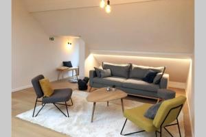 Uma área de estar em StudiO2 Ename, dakappartement in Vlaamse Ardennen