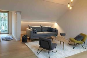 Uma área de estar em StudiO2 Ename, dakappartement in Vlaamse Ardennen