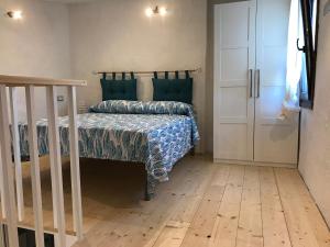 Posteľ alebo postele v izbe v ubytovaní villetta san teodoro IUN Q7135