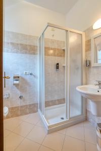 a bathroom with a shower and a sink at Hotel Casa Piantoni in Limone sul Garda