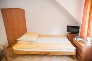 Postel nebo postele na pokoji v ubytování Dom Gościnny Zielono Mi