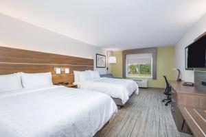 a hotel room with two beds and a flat screen tv at Holiday Inn Express & Suites - Elkhart North, an IHG Hotel in Elkhart