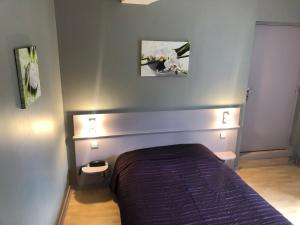 Postel nebo postele na pokoji v ubytování L'embellie