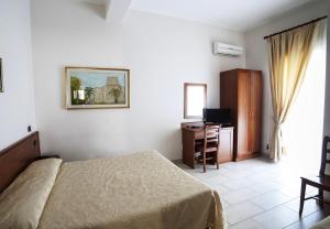 TV a/nebo společenská místnost v ubytování B&B Centrale Affittacamere