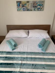 Łóżko lub łóżka w pokoju w obiekcie E&E Apartments