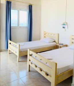 Krevet ili kreveti u jedinici u okviru objekta Seaside Bungalows Petalidi