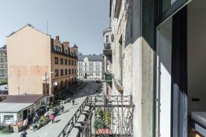 a view of a city street from a window at Apartament Matejki E in Bielsko-Biala